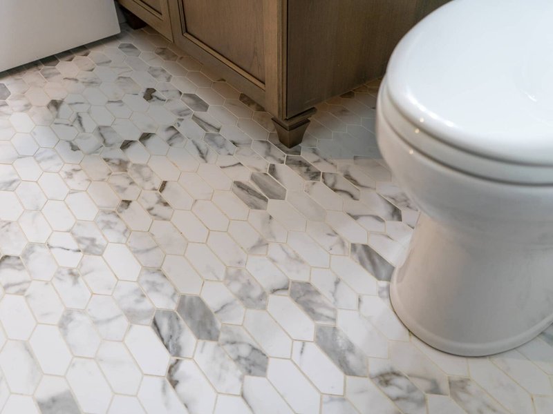 Stylish patterned marble tile flooring in a bathroom