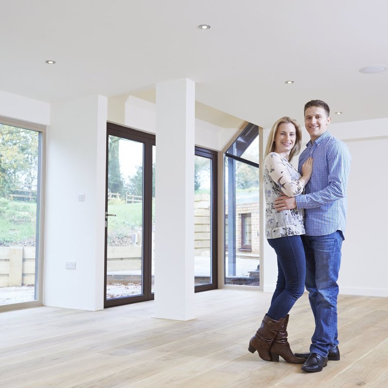 Couple in a new home with laminate flooring